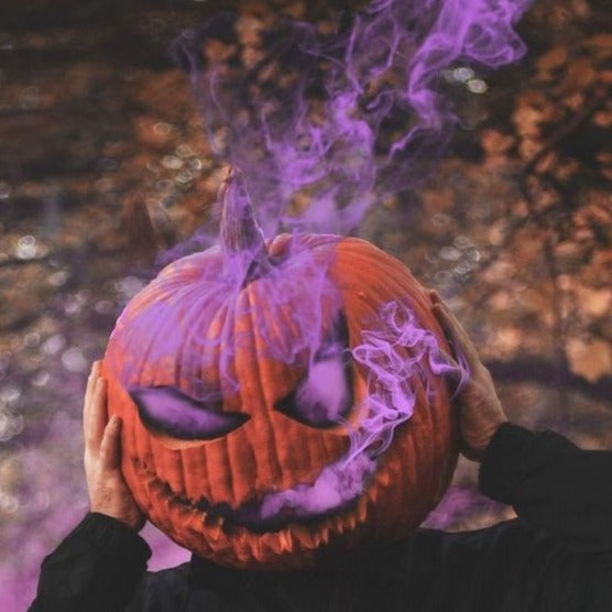 halloween photography purple smoking pumpkin